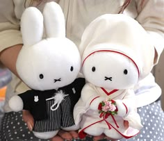 two stuffed animals are dressed up as bride and groom