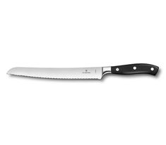 a large knife with a black handle on a white background