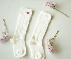 Long white kids socks with embroidered heart! Can it be any cuter?  Made from soft cotton, these knee-high socks feature adorable custom embroidery, perfect for adding a touch of elegance to any baby's wardrobe. Comfortable and stylish, these socks are ideal for everyday wear or special occasions. Color of the socks: White Size: 8-10, for feet of around 14-16 сm (5.5' - 6.2') Color of the embroidery: 10 colors available, you can see them in the pictures above ❤ SHIPPING *Please make sure your sh Playful Fitted Cotton Socks, Cotton Socks For Spring Gift, Spring Cotton Socks Gift, Spring Gift Cotton Socks, White Fitted Cotton Knee-high Socks, Fitted White Cotton Knee-high Socks, Soft White Knee-high Socks, Soft Fitted Cotton Socks, Cute Soft White Socks