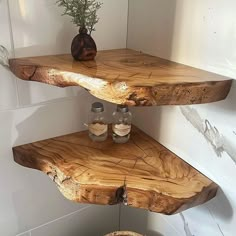 two shelves made out of wood with jars on them