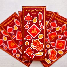 four red and yellow stickers on top of each other with chinese writing in the middle