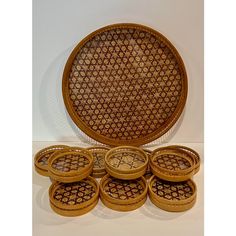 a group of wooden plates sitting next to each other