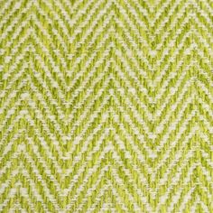 an upholstered green and white fabric with small zigzag lines on it