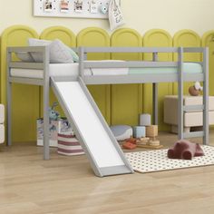 a bunk bed with a slide in front of it