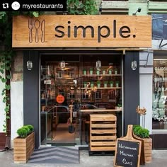 an image of a store front with plants growing out of the window and on the outside