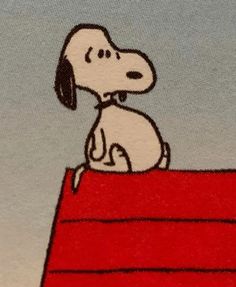 a cartoon dog sitting on top of a red bench