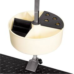 a white cup holder with four compartments on it's side and two black trays in the middle