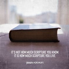 an open book sitting on top of a table next to a window with the words it's not how much scripture you know