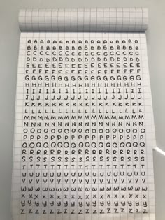 a sheet of paper that has letters and numbers on it, in the shape of a grid