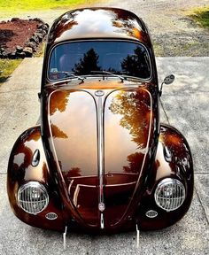 an antique car is parked on the street