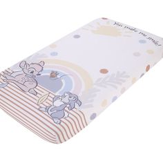 an image of a baby crib sheet with cartoon animals on the front and sides