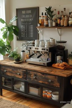 an espresso machine sitting on top of a wooden counter next to a potted plant