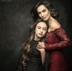 two women are posing for a portrait together