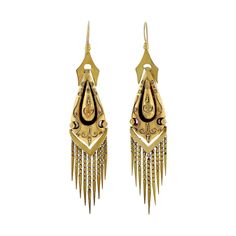 A fantastic pair of foxtail fringe earrings from the Victorian (ca1880) era! Crafted in 15kt yellow gold, these stunning earrings display a dramatic hanging design. Each side features an elaborate 3-dimensional teardrop shaped link that appears to "float" at the center of a similarly shaped link. Incredible Etruscan-style swirled wirework and various sized beaded accents embellish the entire link, adding a wonderful texture to the design. Swinging freely at the bottom from a V-shaped link is a foxtail fringe comprised of graduated rows of articulated spears. The earrings dangle from an ornately shaped surmount, attached to a simple wire at the top. Despite their substantial look and length, the hollow design is wonderfully lightweight for comfortable wear. These stunning earrings frame the Earring Frame, Earrings Display, Victorian Engagement Rings, Hanging Design, Antique Wedding Rings, Victorian Gold, Earring Display, Jewel Box