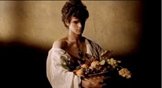 a man holding a basket full of fruit