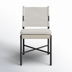 an upholstered chair with black legs and a white fabric seat cover on the back