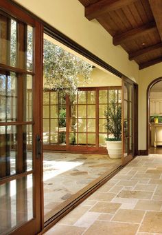 the inside of a house with large glass doors