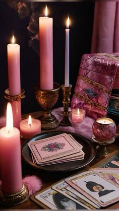 a table topped with lots of candles and cards