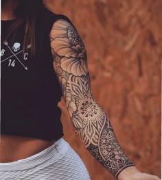 a woman with a tattoo on her arm