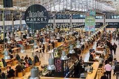 an indoor market filled with lots of people