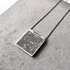 Square pendant is a minimal piece where concrete mixture is set into a gold plated frame. The chain is rhodium plated silver and it comes in three lengths for you to choose. Item will be gift wrapped ready to give or keep. If you would like us to send the jewelry directly to the recipient, all you need to do is to write the recipient address as the shipping address. If you want to add a note to the recipient you can send me a message with the note you want to include! Every piece is made by hand, so the piece that you will receive will be slightly different from the one that is pictured. This makes each piece unique Feel free to contact me if you have any questions or requests Due to monitor differences, actual colors may vary from what you see in the photos Please note that plating is not Jewelry Minimal, Concrete Jewelry, Jewelry Statement, Minimal Jewelry, Square Pendant, Statement Pendant, Keep Jewelry, Jewelry Silver, Etsy Fashion