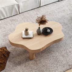 a coffee table with two vases on it