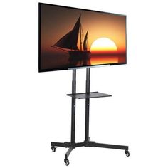 a flat screen tv sitting on top of a metal stand