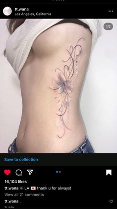 a woman's stomach with a tattoo on her lower back and the bottom part of her body