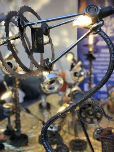 a close up of a metal object with many different types of gears on display in a store