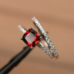 Garnet Engagement Rings, Engagement Rings Cushion Cut, Red Gemstone Ring, January Birthstone Rings, Garnet Engagement Ring, Black Gold Jewelry, Engagement Rings Cushion, Cushion Cut Engagement Ring, Wedding Rings Solitaire