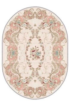 an oval rug with pink and white flowers on the center, surrounded by ornate scrolls