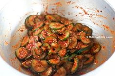 a bowl filled with cooked zucchini sitting on top of a table