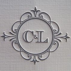 an ornate frame with the letter cj in it's center is shown on top of a piece of paper