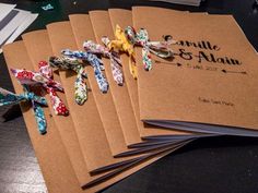 five small hair ties are laid out on top of some brown envelopes with the name danielle and attain written on them