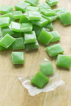 chopped up green food sitting on top of a wooden cutting board