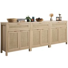 the sideboard is made out of wood and has wicker doors, drawers, and baskets on top