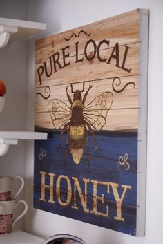 a wooden sign that says pure local honey on it