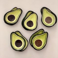 four pieces of avocado sitting next to each other