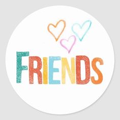 the word friends written in multicolored letters on a white round sticker with hearts