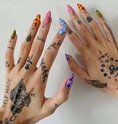 two hands with different tattoos on them