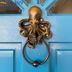 an octopus door knocker on a blue door