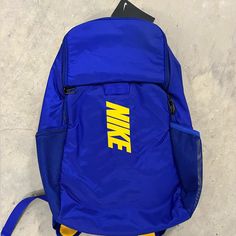 Nwt Nike Brasilia Varsity Training Backpack Blue Gold Da2279-455 Blue Nylon School Bag, Functional Blue Nylon Bags, Nike Standard Student Backpack, Nike Student Backpack, Blue Nylon Bag For Back To School, Sporty Blue Nylon Bag, Blue Nylon Backpack For Back To School, Blue Nylon Everyday Backpack, Everyday Blue Nylon Backpack