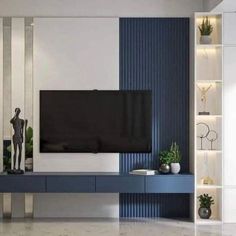 a modern living room with blue and white striped walls, an entertainment center and a large flat screen tv mounted on the wall