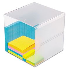 a stack of post - it notes in a clear container