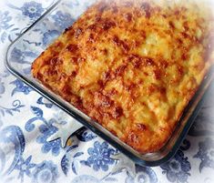 a casserole in a glass dish on top of a blue and white table cloth