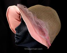 1920s flapper cloche hat in a bell silhouette with the most feminine details!  This is a special piece of authentic 20s millinery, a lady's cloche hat is translucent woven horsehair, with pink velvet flowers and grosgrain ruffled ribbon.  This antique 20s hat has a deep spherical crown and broad bonnet-like pink crepe brim.  Lined in pink-blue-silver faille. Measurements 22 1/4 Inches Circumference at inside edge, Side to Side over the crown approx 15 Inches (ending at crown seam, excluding brim 20s Hat, Flapper Cloche, Flowers Ribbon, Millinery Flowers, Feminine Details, Velvet Flowers, 1920s Flapper, Cloche Hat, Horse Hair