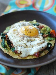 an egg is sitting on top of a tortilla