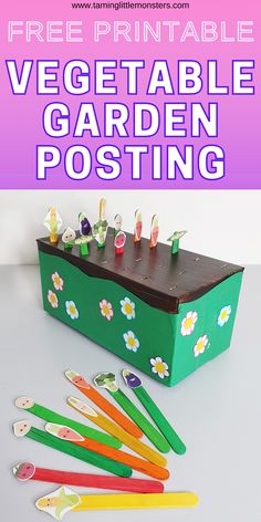 the vegetable garden posting box is made out of paper and plastic spoons, with flowers on it