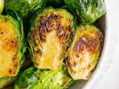 cooked brussel sprouts in a white bowl