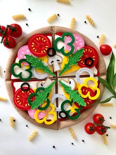 a pizza decorated with vegetables and numbers on it